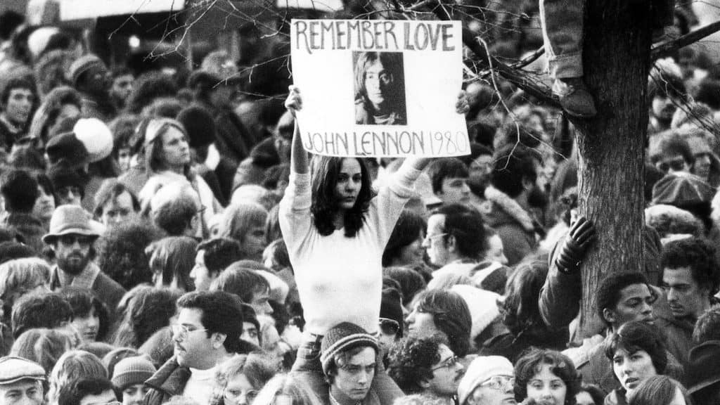 a woman holding a poster