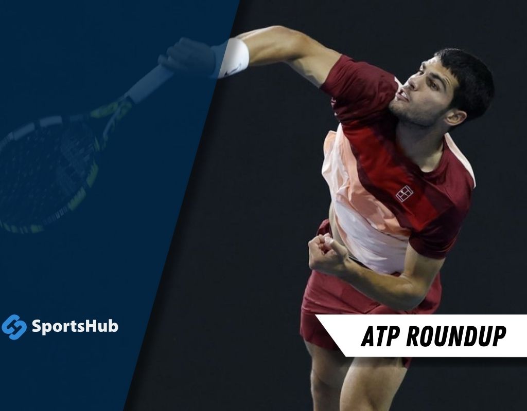 A tennis player serves during a match, showcasing athleticism and concentration with a brightly colored uniform. ATP Roundup is featured.