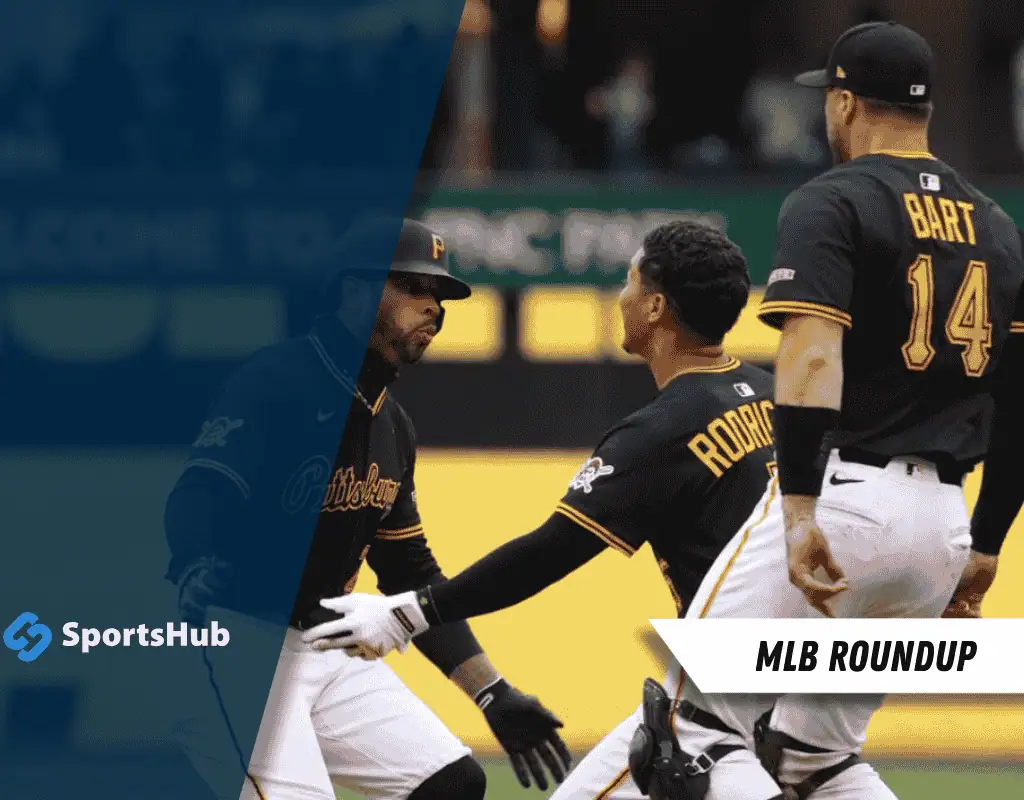 Playful celebration among three Pittsburgh Pirates players in black jerseys, showcasing teamwork and camaraderie on the baseball field.