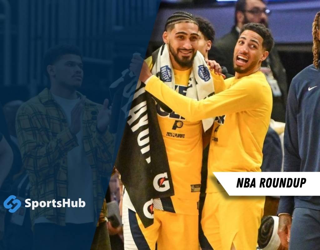 Three basketball players celebrate on the court, wearing yellow jerseys.