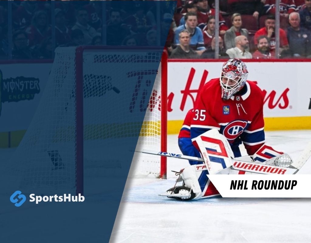 A goaltender in a red Canadiens jersey crouches in front of the net during a hockey game, ready to block a shot.