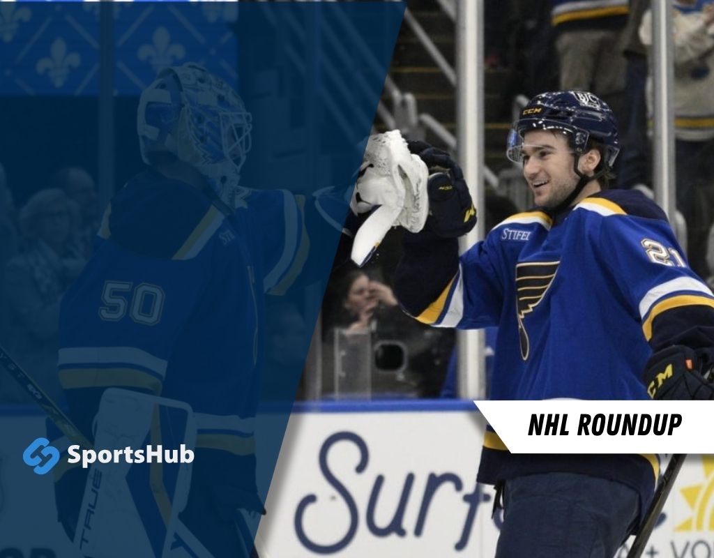 A St. Louis Blues player celebrates on the ice with a joyful gesture, while a goalie in the background prepares for the game.