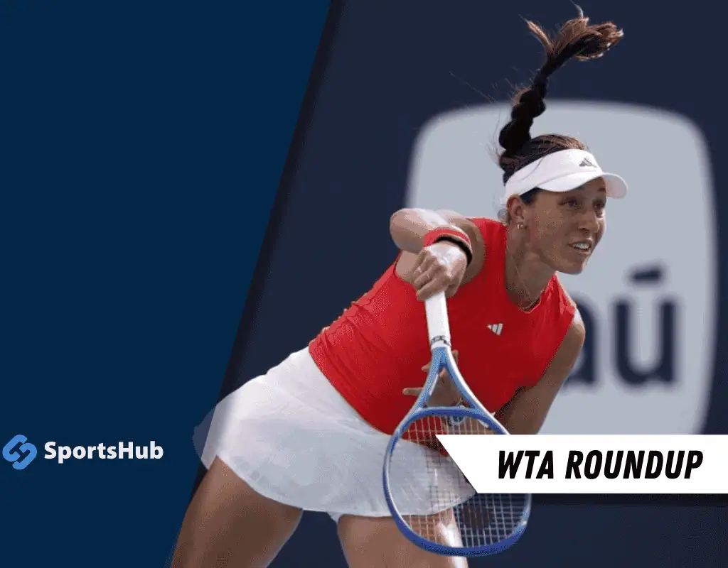 A female tennis player in a red top serves the ball, showcasing her athleticism on the court with a blue racket.