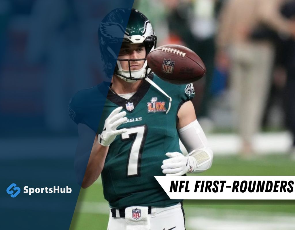 An NFL player in a green Eagles jersey catches a football during a game