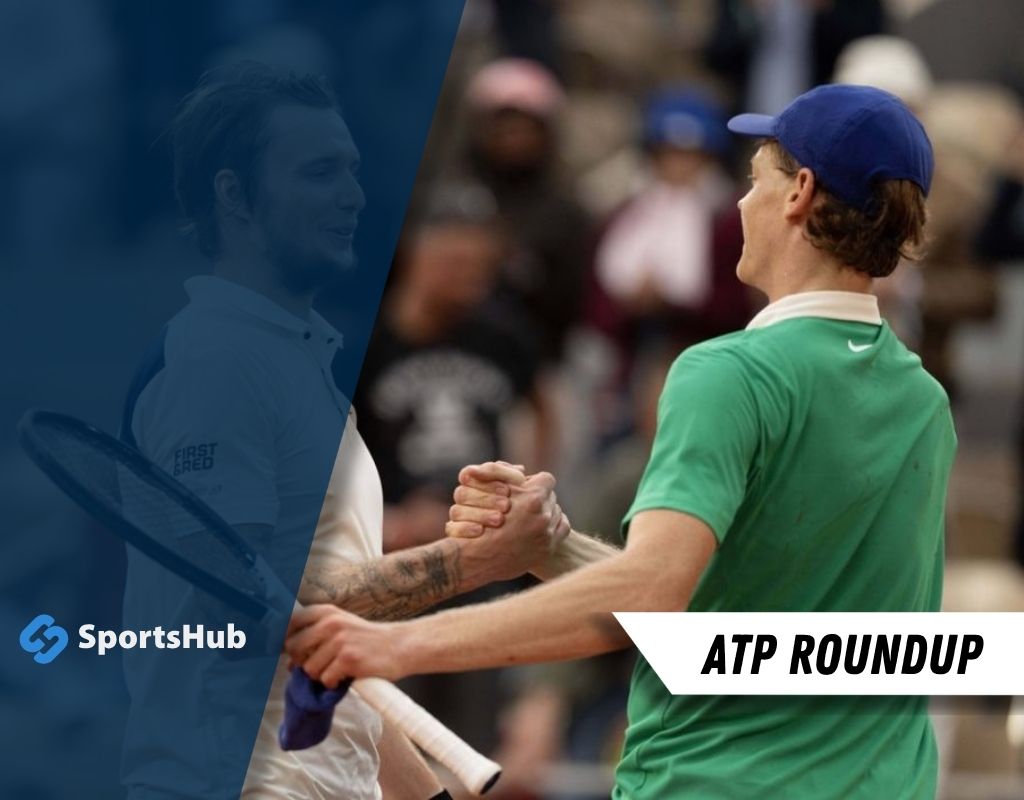 Two tennis players shake hands at a tournament, displaying sportsmanship after a match,