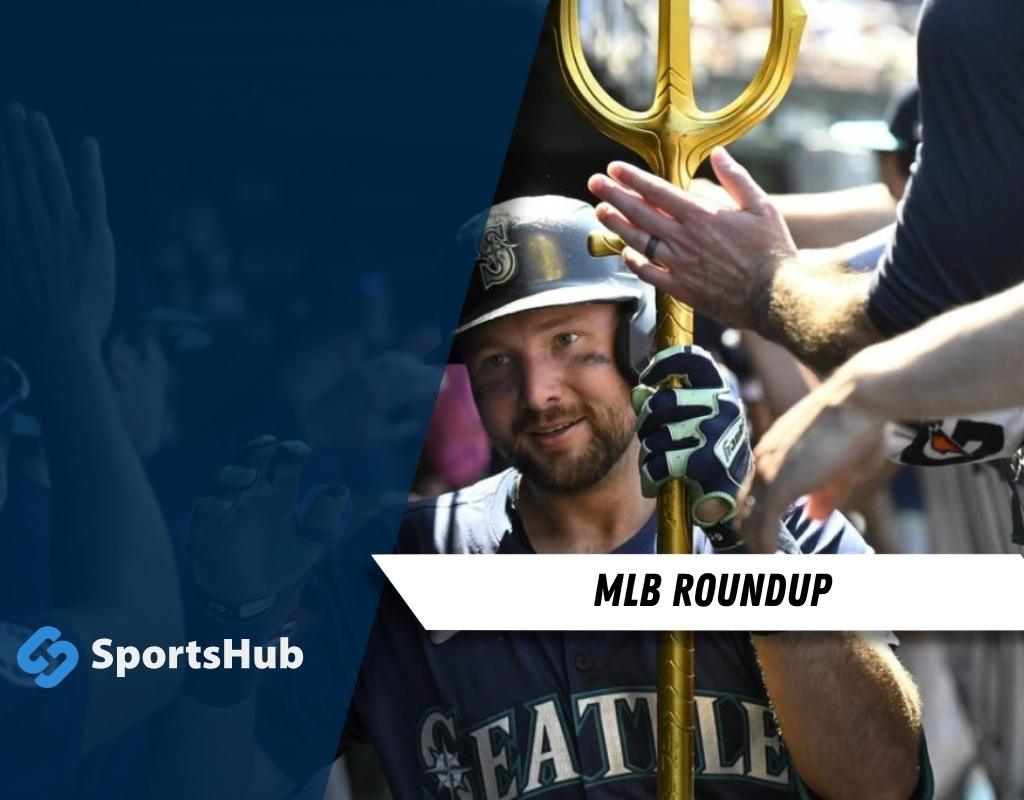 A jubilant baseball player in a Seattle jersey holds a golden trident, surrounded by cheering fans at a lively MLB game.