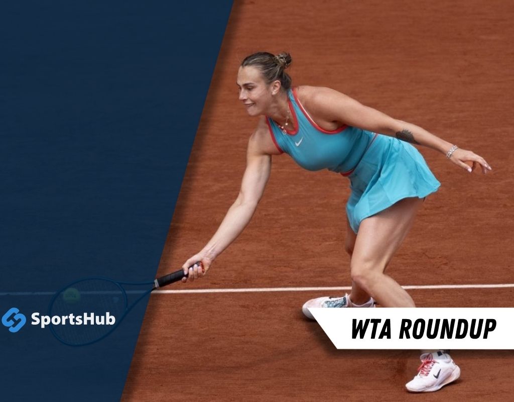 A female tennis player in a turquoise outfit prepares to hit a shot on a clay court, showcasing athleticism and focus.
