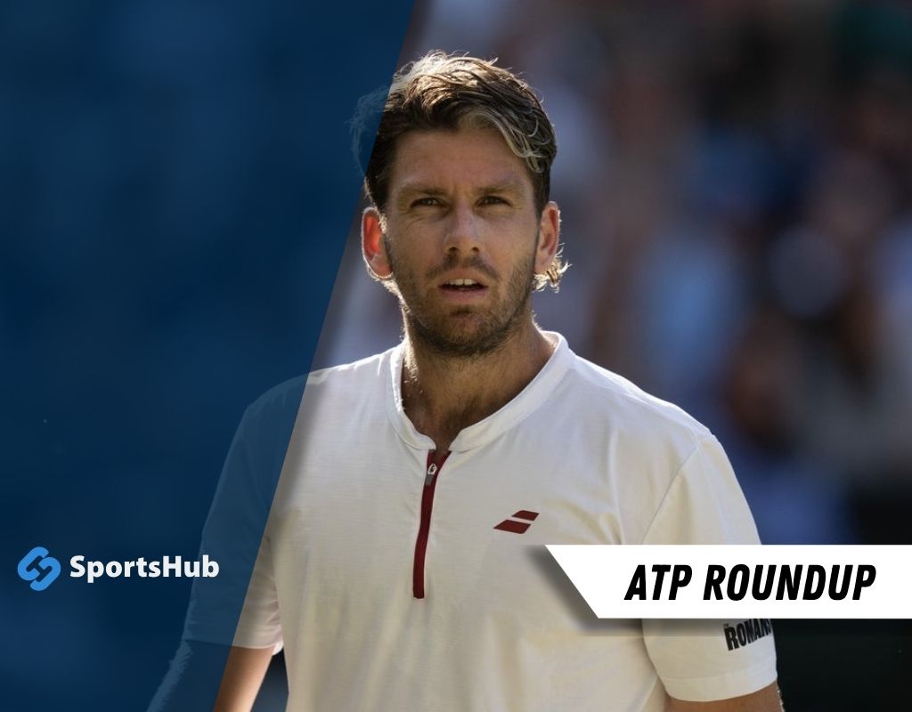 A tennis player in a white shirt with red accents stands on the court, focused and ready for the upcoming match. SportsHub logo visible.