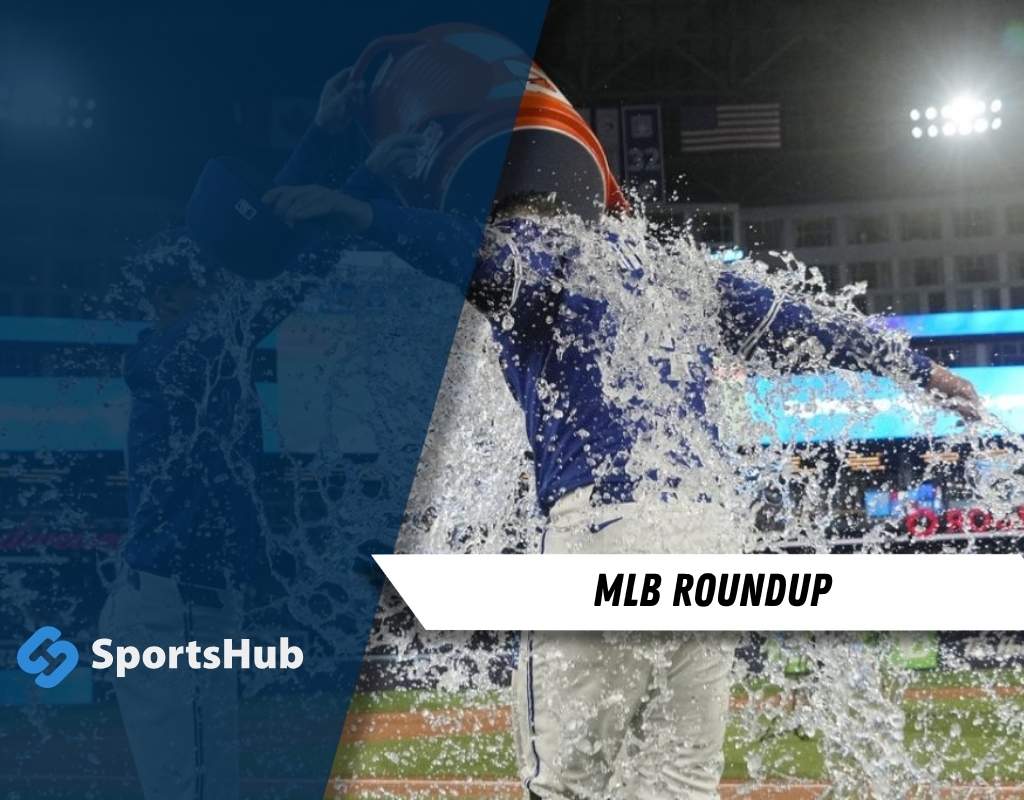 A baseball player is seen splashing water, possibly after a play or during a moment of celebration.