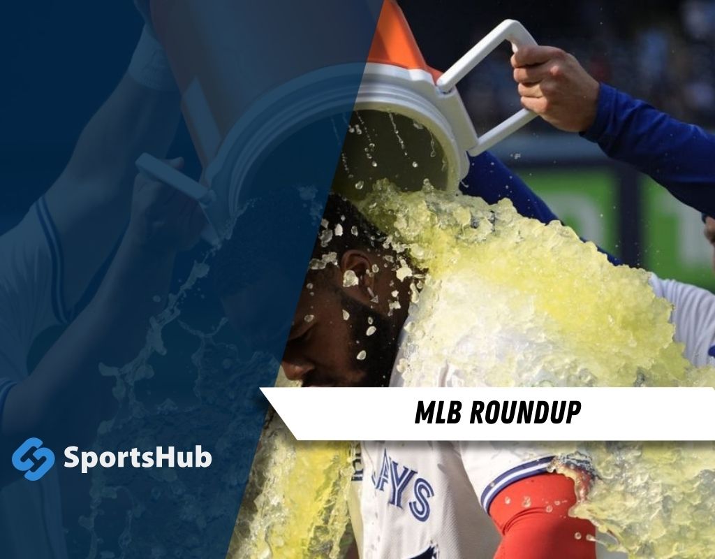 A player is being doused with a colorful beverage from a cooler in celebration, showcasing the excitement of a sports victory.