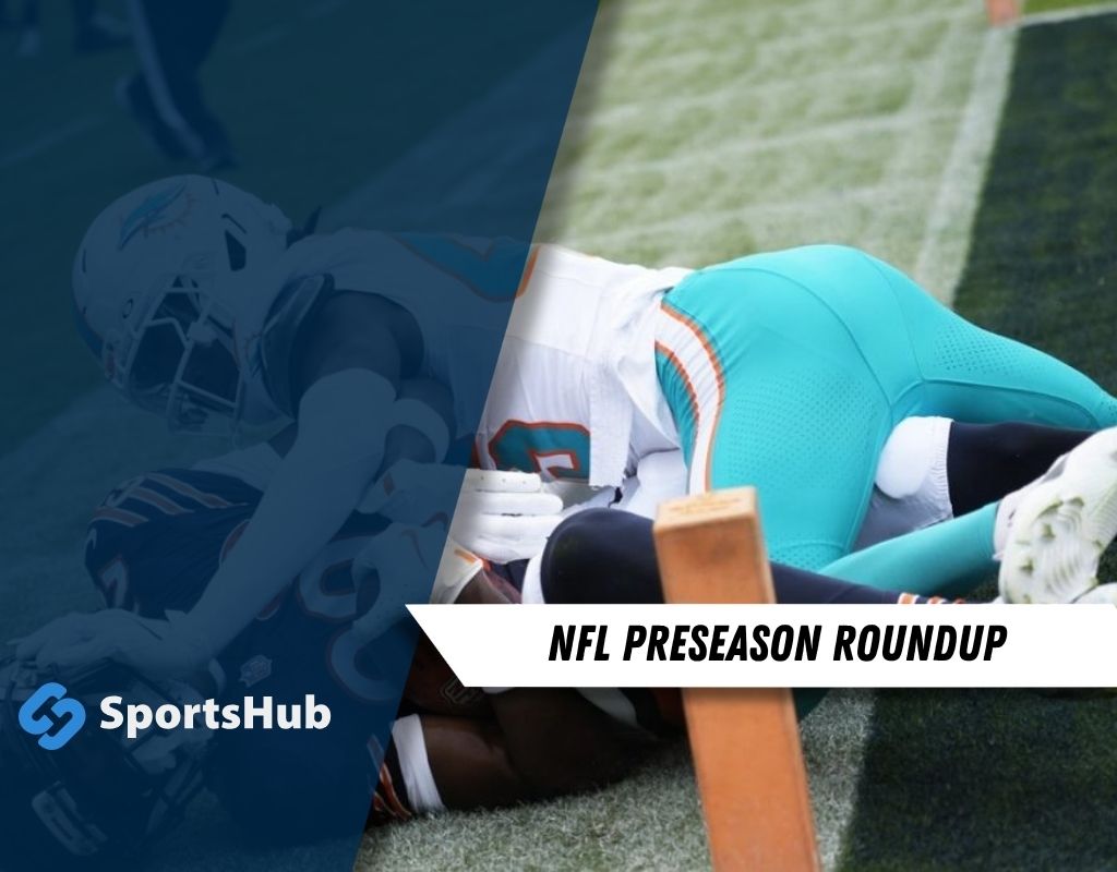 A Miami Dolphins player tackles a Chicago Bears player during an NFL preseason game.