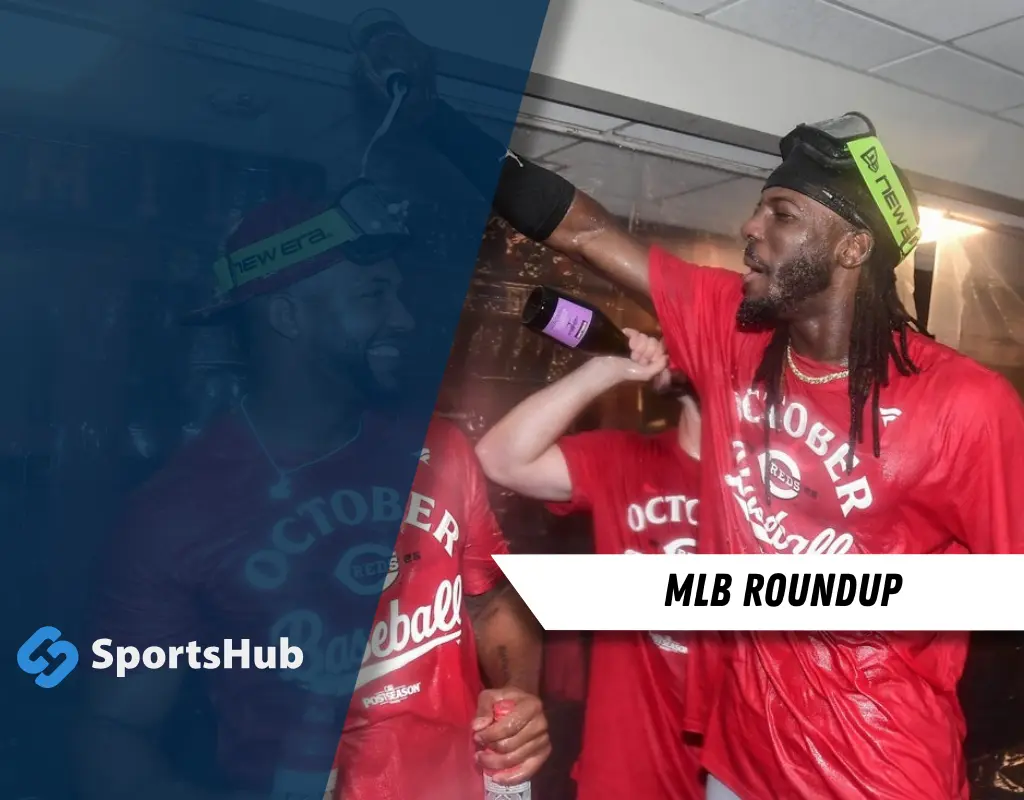 Reds players celebrate in locker room during MLB